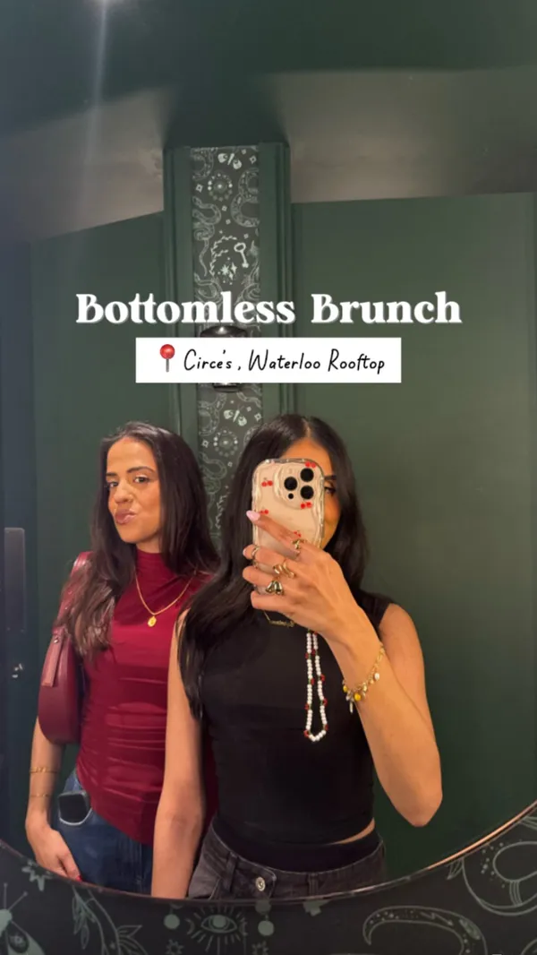 This video promotes Circe's Waterloo Rooftop bottomless brunch. The video starts with a shot of the restaurant's sign. It then shows a woman walking into the restaurant, followed by shots of the bar area and champagne glasses on a table. The video then shows a group of people toasting with drinks, followed by shots of food, including a flatbread with vegetables and a slice of cake. The video also shows two women singing on stage and people enjoying drinks and food at a table. The video ends with shots of people dancing and having fun.