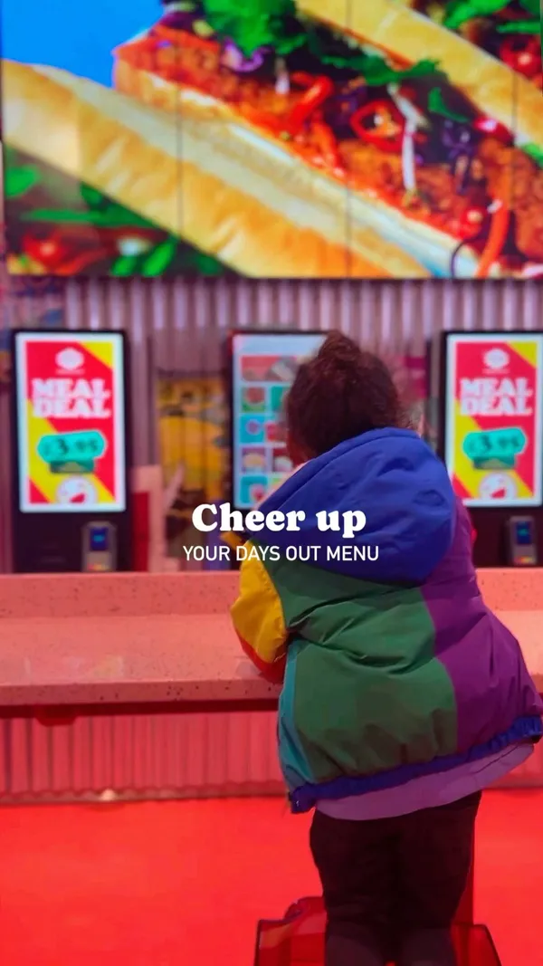 The video showcases Hop Vietnamese Street Food, highlighting its vibrant interior design, kid-friendly atmosphere, and menu items. It features various dishes such as banh mi, rice bowls with meat and vegetables, and bubble tea. The presentation emphasizes the bright colors and appealing visual aspects of the food and drinks, along with the restaurant's lively decor. Dietary options are not explicitly shown but a kids menu is mentioned in the caption.