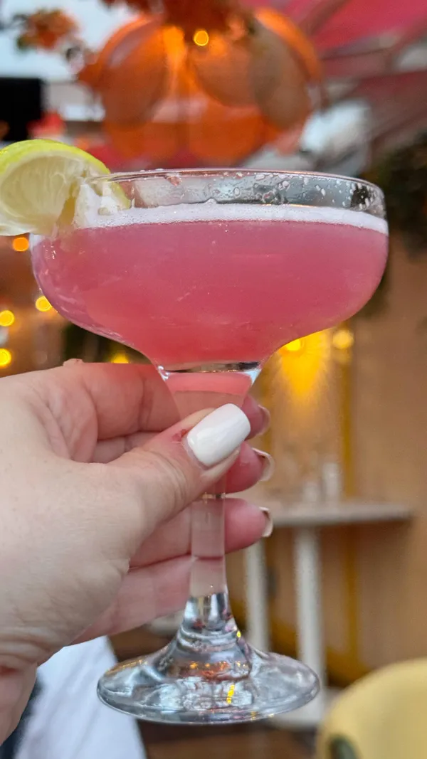 The video showcases a visit to Circes Rooftop bar in London. It features shots of various cocktails, the bar's interior with patrons enjoying drinks and the view, a bartender preparing a drink, and the London skyline from the rooftop. The atmosphere appears lively and vibrant.