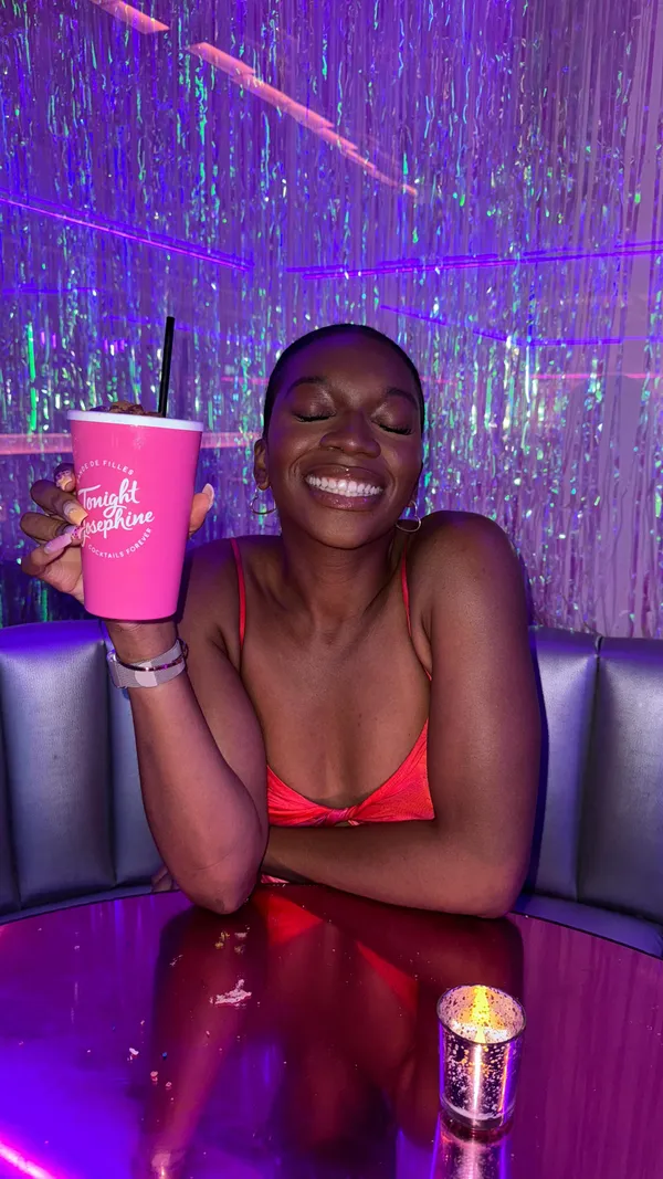 This video showcases a visit to Tonight Josephine, a bar in Waterloo, featuring their new espresso cocktail range in collaboration with Kahlua. The video highlights three cocktails: Salted Caramel & Pistachio Espresso Martini, Bueno Frappe, and another cocktail from the regular menu. The cocktails are presented in pink cups with whipped cream and cotton candy toppings. The bar’s interior is also showcased, featuring neon lighting, a stylish interior, and plenty of space. The main focus is on the cocktails and the bar's atmosphere.