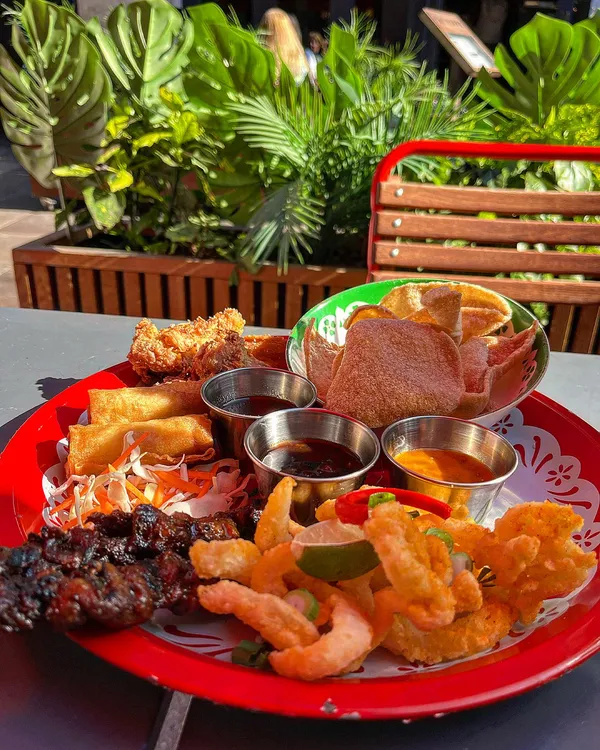 🇹🇭 ROSAS IN THE SUN ☀️ @rosasthai @joli_app 

Give me a Thai platter in the sun anydaaaaay and I’m a happy woman! I was so excited to try @rosasthai again and this time I got to enjoy their Songkran Family Feast to celebrate the Thai New Year 🎉 

The menu is £30 per person for 3 courses including some complimentary dishes 🤩 Not only is this excellent value for money but there genuinely is enough food to verify calling it a ‘feast’. 

The classic platter to share is my absolute favourite and includes Thai fried chicken, spring rolls, pork skewers, calamari and prawn crackers with a variety of lush dipping sauces 😍 We also tried their special dish called ‘Larb Gai’ which is essentially a minced chicken salad but OMG it was absolutely delicious and packed full of flavour. Not something I would originally go for but so glad we tried it! 

Obviously had to finish with some Thai style churros and my favourite condensed milk dipping sauce 🤤🤤 So moreish.. 

Our waiter Hoi was an absolute gentleman and has provided excellent service on my last few visits - thank you! ☺️

•
•
•
•
#rosas #rosasthai #thaifood #thaimeal #thairestaurant #thaiplatter #cardiff #cardiffrestaurants #cardifffood #cardiffffoodie #cardifffoodblogger #cardiffbloggers #foodie #foodblog #foodstagram #foodblogger #songkran #songkranfestival