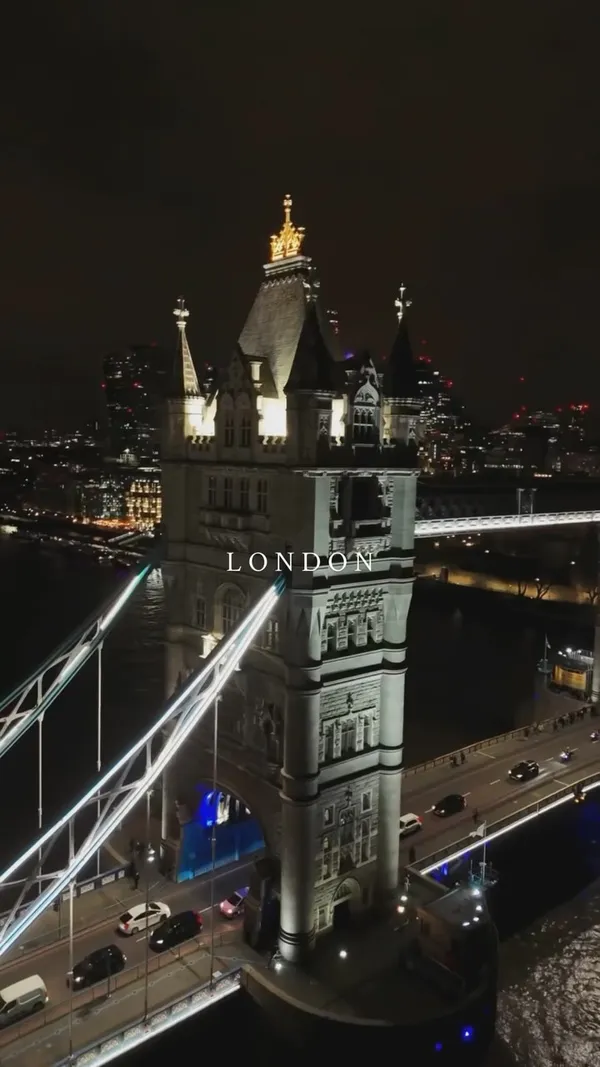 A fast-paced montage video showcasing iconic landmarks in London. The video features various shots of Tower Bridge, Big Ben, the London Eye, and a Westminster Underground station sign, captured at different times of day including daylight, dusk, and night. The clips are set to upbeat, popular music, creating an aspirational and energetic travel-themed video. A consistent text overlay with the word 'LONDON' is present in most scenes.