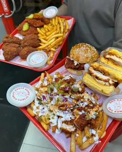 Nashville hot chicken dishes at Jims in Cheadle, Manchester, including burger, Nash-wich, tenders, wings, and loaded fries.
