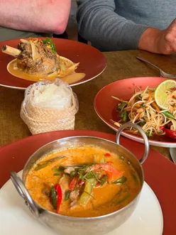 Delicious Thai dining at The King's Wine and Cocktails in Clitheroe featuring duck penang, squid starter, and Som Tam salad.