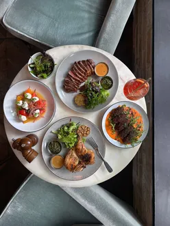 Albie London summer menu at The Hoxton Hotel: Panzanella, tahini falafels, grilled beef or chicken, gelato, cocktails, and more.