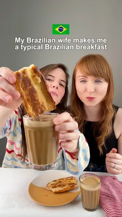 My Brazilian wife makes me a typical Brazilian breakfast 🇧🇷✨

This is the quintessential Brazilian breakfast. It’s a French-style bread roll sliced in half, spread with butter, and toasted on a hot griddle, a classic in Brazilian bakeries (padarias).

Pingado: coffee with a dash of milk (literally “a drop”), usually served in a simple glass.

Some people eat this combo standing at the counter before work. Do yourself a favour and make up a batch of Brazilian French bread (pão francês) and start your mornings this week like a proper Brazilian ❤️💚💛

This combo is particularly popular in São Paulo, where I’m from. In other parts of the country, a typical breakfast might include cuscuz (steamed cornmeal), tapioca, pão de queijo (cheese bread), or cake with coffee, depending on the local culture.

Ingredients:

-1 fresh pão francês bread roll, sliced in half
-Butter @kerrygoldirl 
-Your favourite coffee with milk

Method: 

Liberally spread the butter (be generous!!) on the inside of the bread.

Now fry in a hot frying pan, flattening it slightly with your spatula so all the butter becomes golden and crispy. Add some extra butter to the pan if you feel like it. ;)

Stick on some samba or bossa nova and enjoy your baguette dipped into milk and hot coffee (optional but recommended). 😜

#brazilianrecipes 
#paonachapa
#breakfastrecipes
#brazilianfood 
#paofrances
#padaria