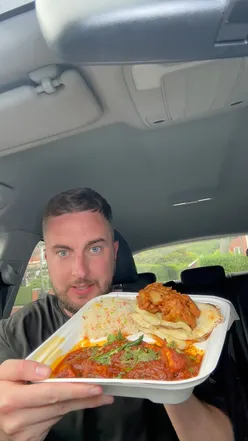 Curry, rice, naan, and onion bhajis from Dawat Tandoori in Romiley, all for under £10, perfect for curry lovers and Manchester foodies.