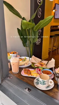 Kopitiam breakfast at Sudu London with soft-boiled eggs, Kaya toast, Nasi Lemak, Bihun, Roti Telur, Kacang Pool, and sardine toast.