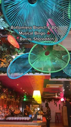 Delicious Shoreditch brunch with bottomless drinks in London, featuring vibrant dishes and lively atmosphere.