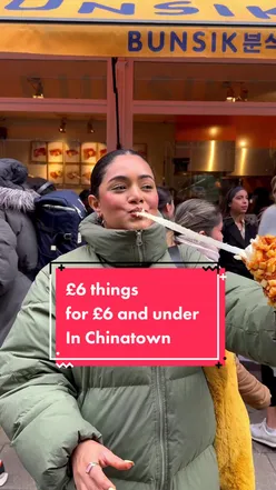 Assorted Asian street food in Chinatown London: Korean corn dogs, jianbing, pandan cake, taiyaki, popcorn chicken, custard bun.