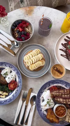Empty plates after a satisfying halal brunch in London during Ramadan 2023, showcasing popular food spots.
