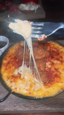 Cheesy mac & cheese with a satisfying cheese pull at Hickory's Smokehouse Shrewsbury.