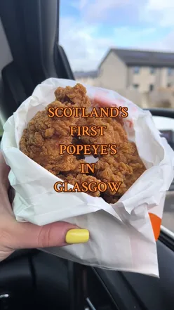 Fried chicken and cajun fries from Popeyes UK in Barrhead, Glasgow, showcasing delicious takeaway food.