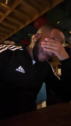 Colorful cocktails at Rum Kitchen Brixton, vibrant drinks on a wooden table, perfect for a fun night out.