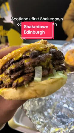 Juicy beef burger at Shakedown's Edinburgh launch night, praised as the best ever by attendees.