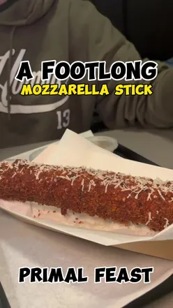 Footlong mozzarella stick at Primal Feast, a halal restaurant in Glasgow's southside, known for fresh smash burgers and new fried chicken.