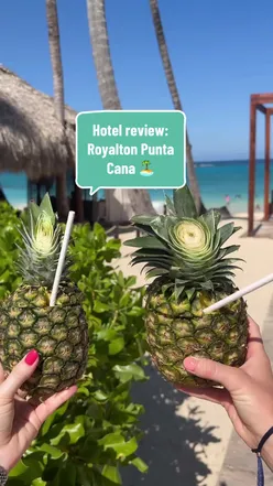 Royalton Punta Cana resort beach view with BBQ grills, family water park, and picturesque Sands beach bar in Dominican Republic.