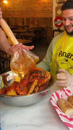 Delicious seafood boil at Angry Crab Shack: king crab, lobster, oysters, calamari, and deep-fried Oreos.