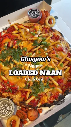 Loaded naan with chicken tikka, firecracker chicken, and salt and chilli chips at Chilli Grill, Glasgow.