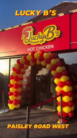 Launch of Lucky B's hot chicken on Paisley Road West, Glasgow, with fire eater, sax, DJ, and foodies celebrating.