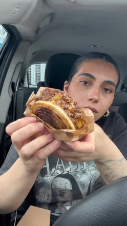 Onion Wrapped Flying Dutchman burger at Smoke & Pepper, featuring juicy beef patties and melted cheese, In-N-Out style.