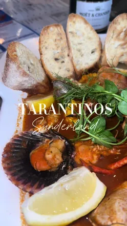 Close-up of Tarantinos' upgraded seafood boil with lobster, prawns, and chicken skewers in Sunderland restaurant.