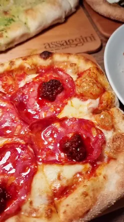 Italian tapas at Assaggini George Square with pizza, pasta, and wine in a cozy Glasgow restaurant setting.