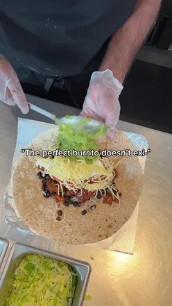 Close-up of a delicious burrito with fresh ingredients, perfect for finding the best burritos in London hotspots.