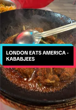 Plate of flavorful Pakistani biryani with garlic naan and kababs at Kababjees, Long Island, New York.