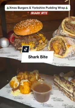 Juicy burger with Yorkshire pudding bun at Sharkbite Burgers, perfect Christmas food delight. #burger #food