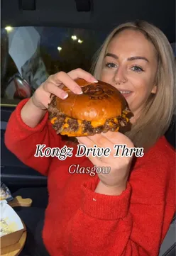 Cheesy burger from Kongz Drive Thru in Glasgow, showcasing delicious melted cheese and fresh ingredients.