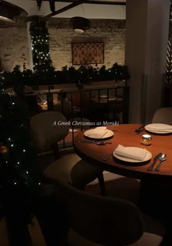Greek mezze dishes and cocktails at Meraki, a cozy, Christmassy Mediterranean restaurant in London.