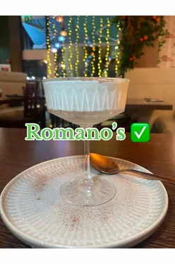 Delicious tiramisu dessert at Romano's Glasgow on Pitt Street, showcasing rich layers and cocoa dusting.