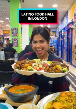 A vibrant spread of Latin American dishes at La Placita Mall, London, featuring Pescado En Salsa De Coco and Beef Empanada.