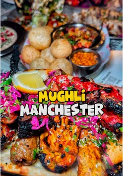 Tandoori scorpion prawns at Mughli Charcoal Pit, a top curry house in Manchester, showcasing vibrant Indian cuisine.