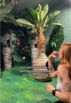 Group of friends enjoying an arcade escape room at Enigma Quests in Holborn, London, filled with fun games.