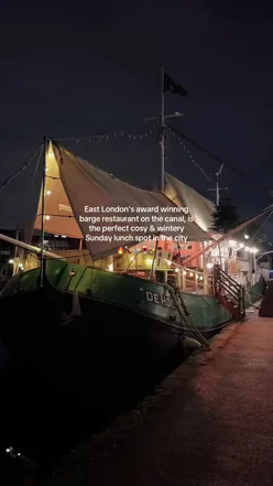 Delicious Sunday roast served on a barge at Barge East, Hackney. Enjoy London dining with scenic river views.