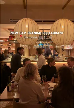 Delicious homemade pizza topped with fresh basil and mozzarella, perfect for a cozy dinner. Food photography.