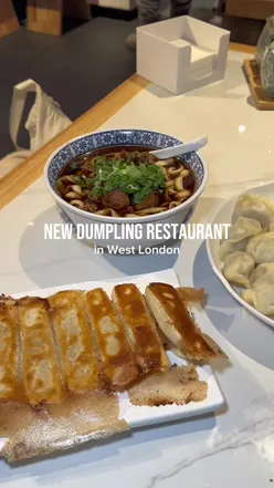 Delicious prawn, pork & chive dumplings and braised beef noodle soup at Mr. Dumpling in Shepherd's Bush, London.