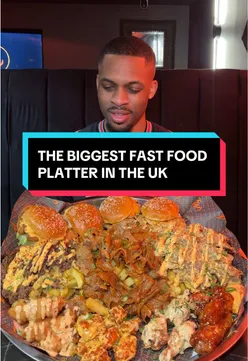 Massive fast food platter with kebabs, burgers, and chicken at Phat 4 Life, London. Quantity over quality.