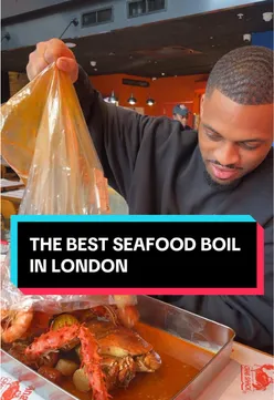 Seafood boil with crab, shrimp, and corn at Angry Crab Shack London Bridge, perfect for seafood lovers.