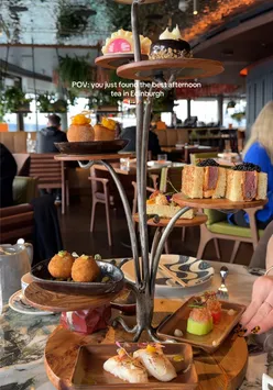 Elegant afternoon tea with sushi and tea at Sushi Samba Edinburgh, featuring delicious Japanese cuisine.