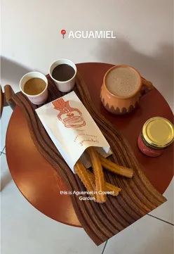 Delicious Mexican churros and drinks at Aguamiel cafe in London, a must-try for dessert lovers.