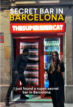 Secret bar in Barcelona disguised as a mini supermarket with bouncer, lively music, friendly bartenders, and drinks from €12.