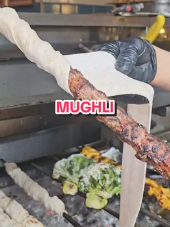 Mughli Charcoal Pit Indian restaurant in Manchester with grilled dishes and vibrant atmosphere.