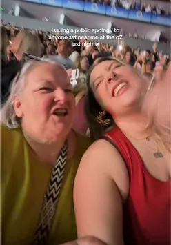 Person singing confidently on stage, showcasing their passion for music and lyrics during a performance.