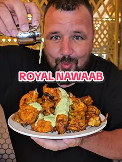 Royal Nawaab Stockport Pyramid buffet with halal Pakistani food, karahi, and desserts in a vibrant dining atmosphere.