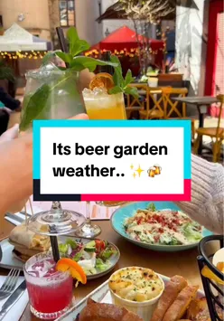Enjoying a sunny beer garden in Glasgow with friends, featuring refreshing drinks and delicious food options.