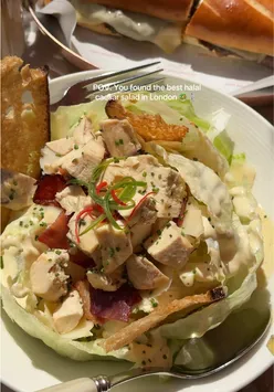 Generous portion of Halal Caesar Salad with chicken or prawns at La Maison Ani, London, perfect for sharing.