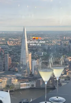 Sunset view from Europe's highest restaurant, Lucky Cat, serving sushi, spicy margaritas, tempura, wagyu, and duck bao buns.